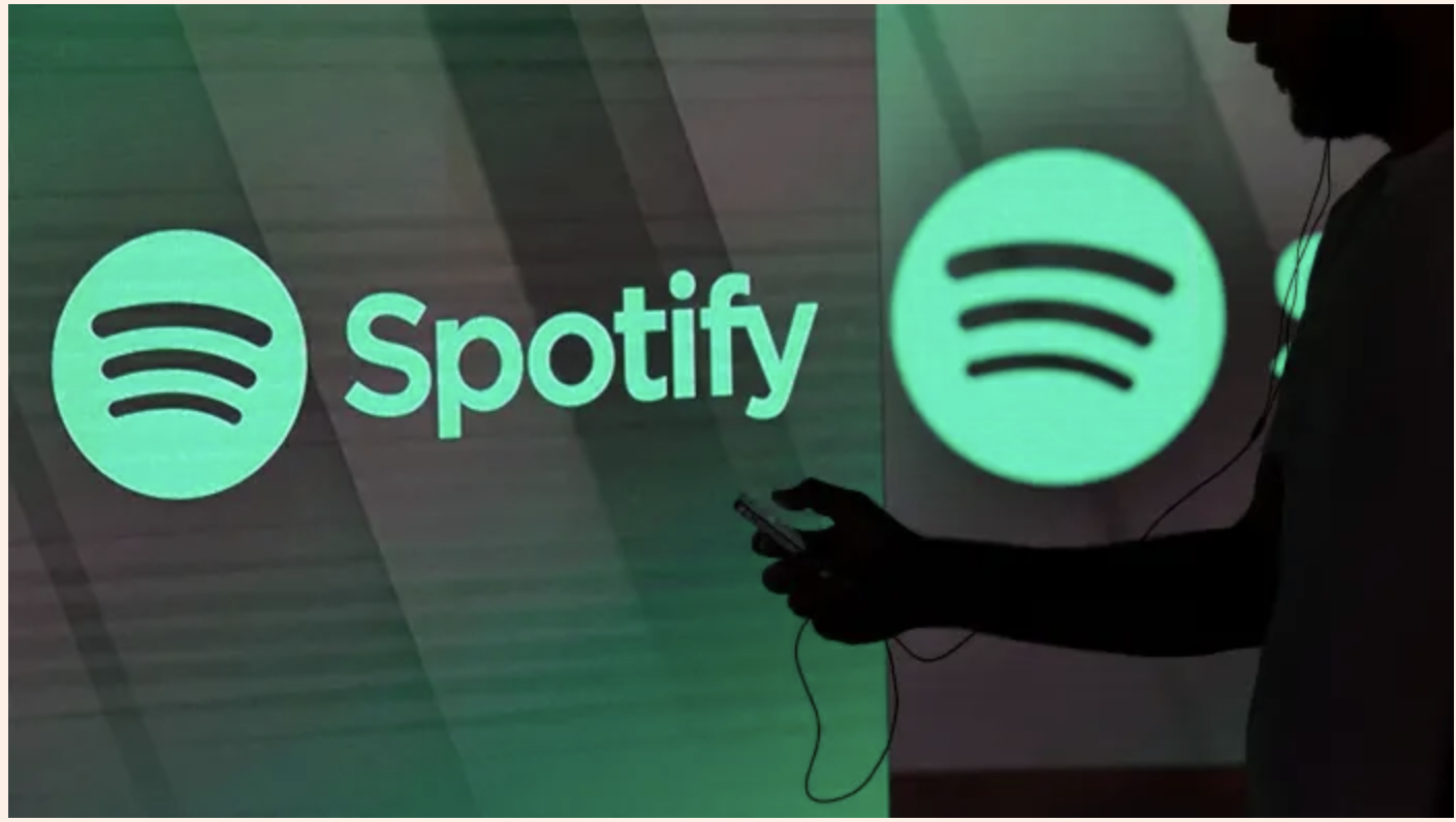 Spotify icon with person listening to music